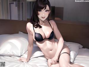 A woman in a black bikini sitting on a bed.
